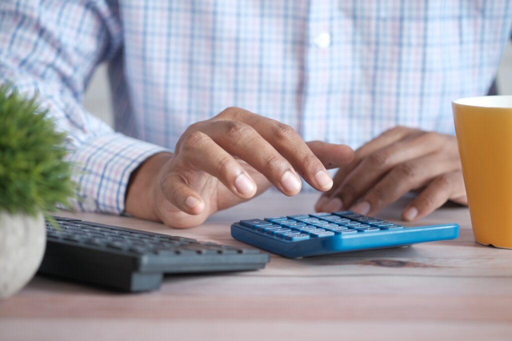 A SACCO Accountant doing accounting in work, which is important to start and run a SACCO